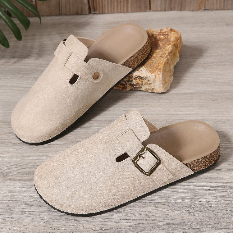 Delphine buckle clogs, pair side view on wooden floor