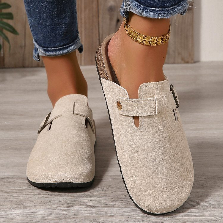 Delphine buckle clogs worn on model, close-up detail