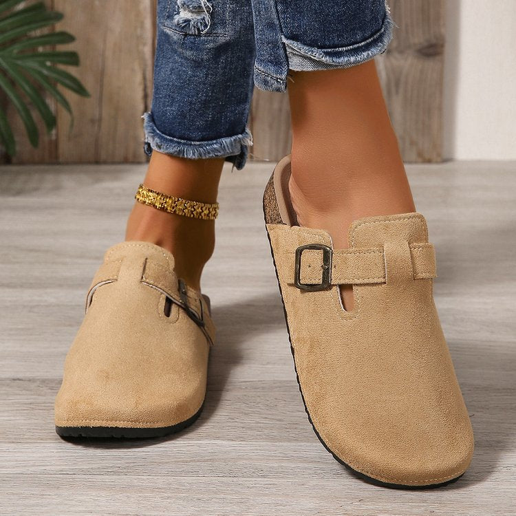 Delphine buckle clogs worn on model, close-up detail