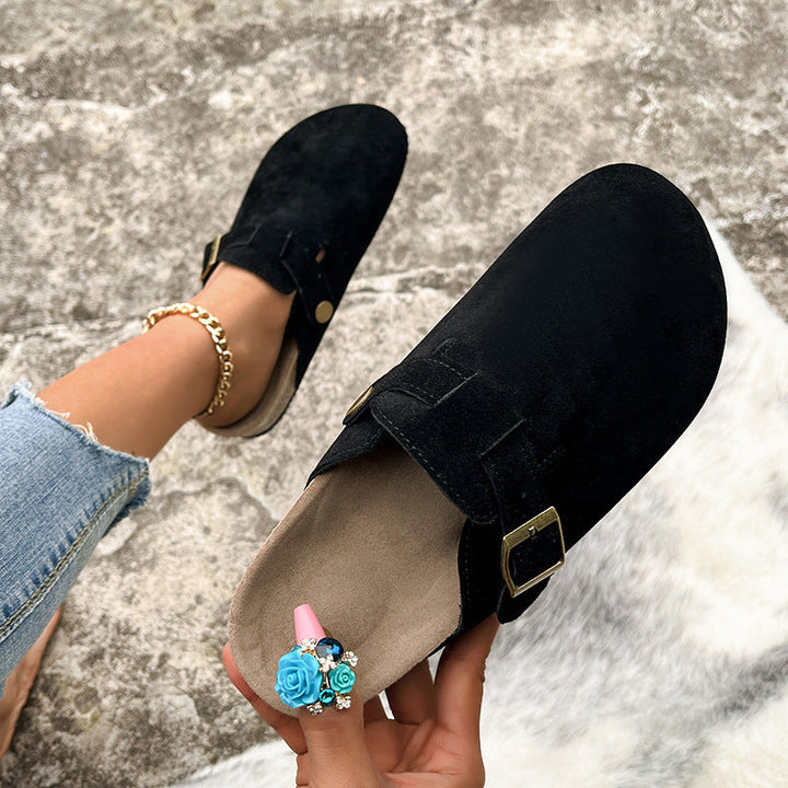 Seraphina buckle strap platform clogs in black, side view with buckle detail