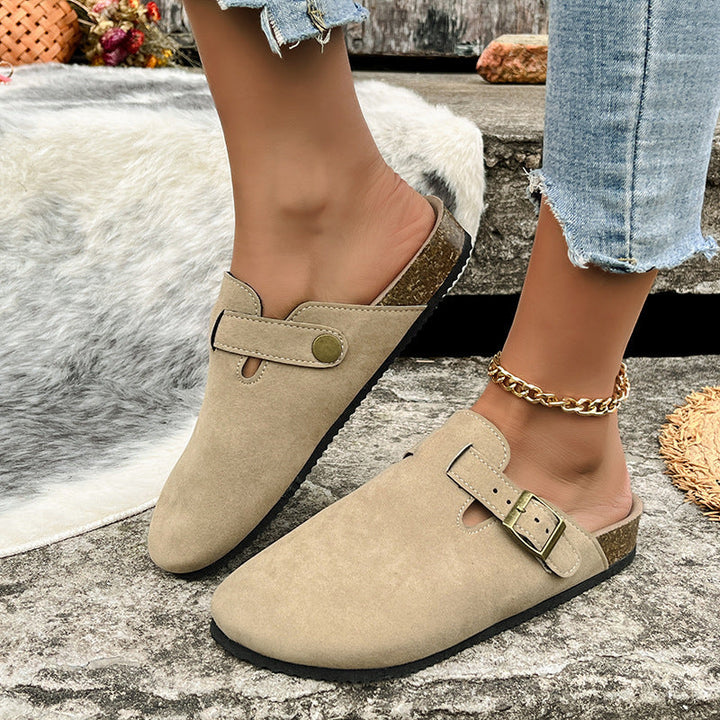 Seraphina buckle strap platform clogs in tan, worn on foot side view