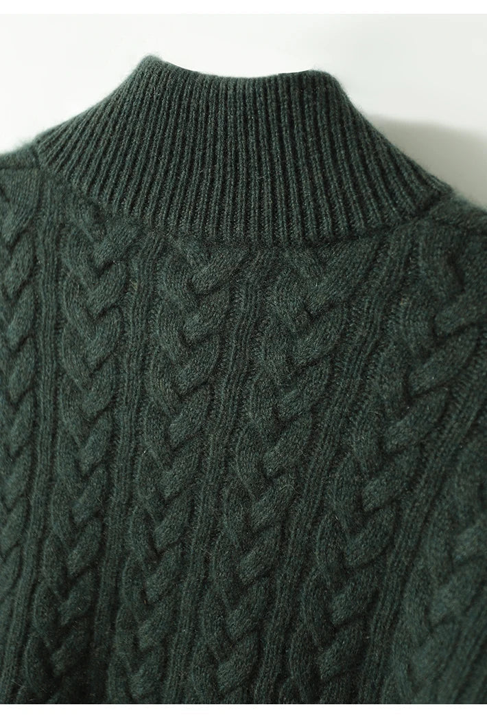 Marigold cable-knit button-up sweater styled with earrings, close-up