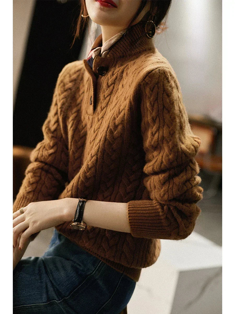 Marigold cable-knit button-up sweater styled with earrings, close-up