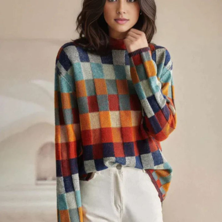 Marisol checkered turtleneck sweater worn by model, front view with white jeans