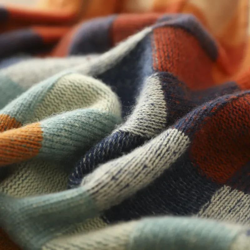 Close-up of Marisol checkered knit sweater fabric and ribbed cuff detail
