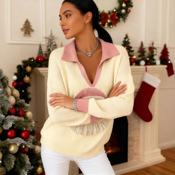 Philippa Christmas Santa sweater styled with white jeans near fireplace