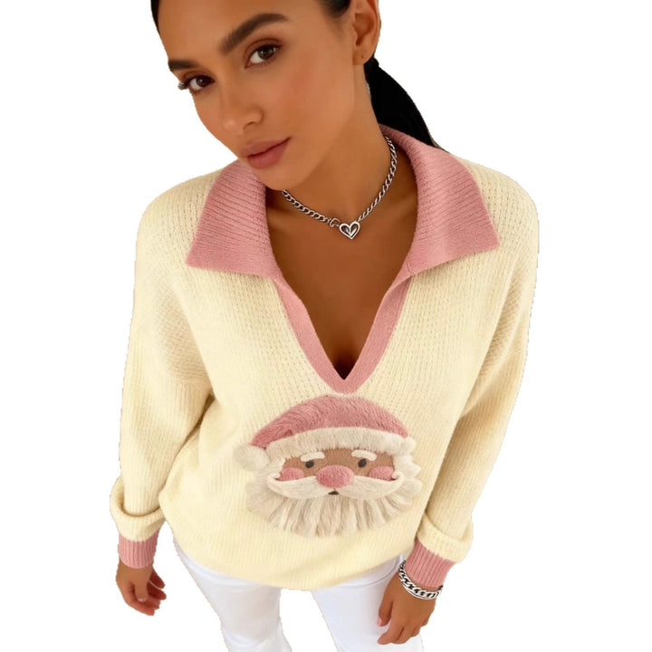 Philippa Christmas Santa sweater styled with white jeans near fireplace