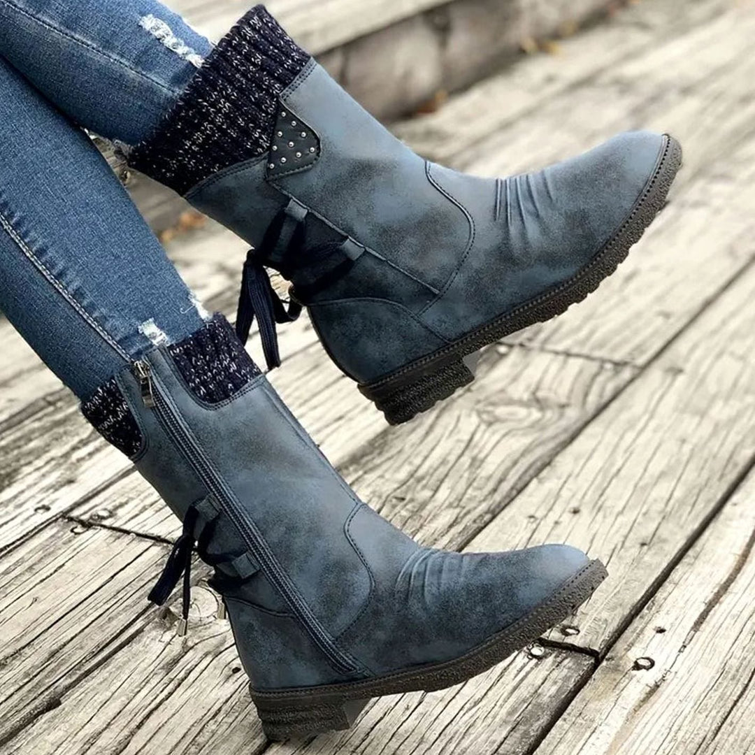 Ophelia blue lace-up ankle boots with knit cuff, side view on model
