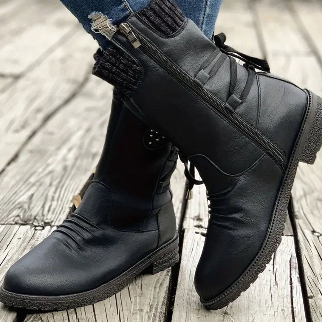 Ophelia pink lace-up ankle boots with studded knit cuff detail, side view on model