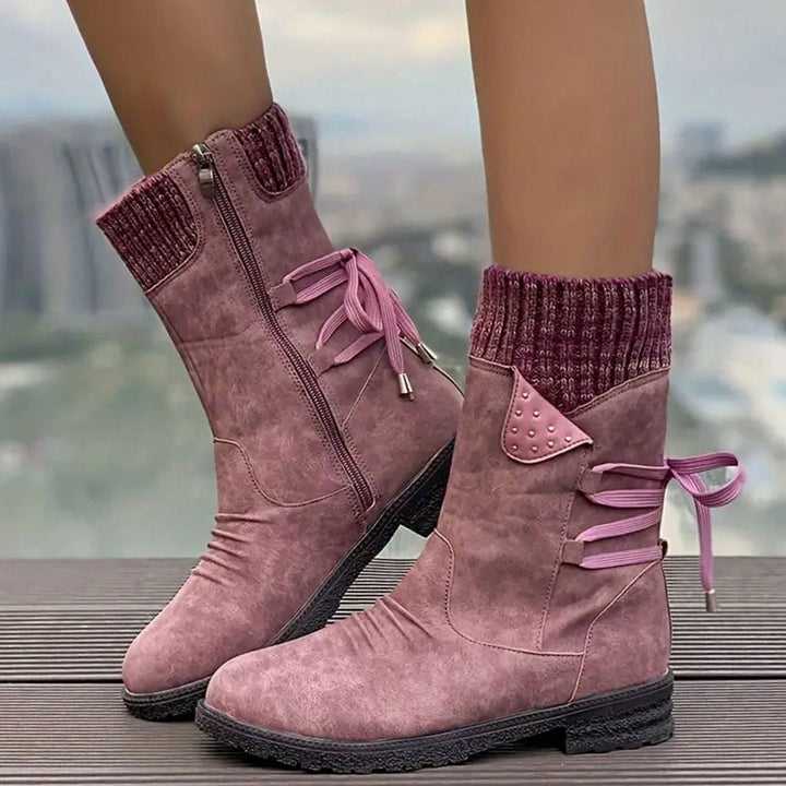 Ophelia pink lace-up ankle boots with studded knit cuff detail, side view on model