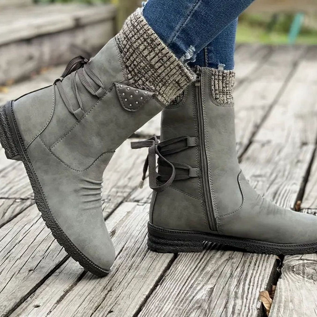 Ophelia pink lace-up ankle boots with studded knit cuff detail, side view on model