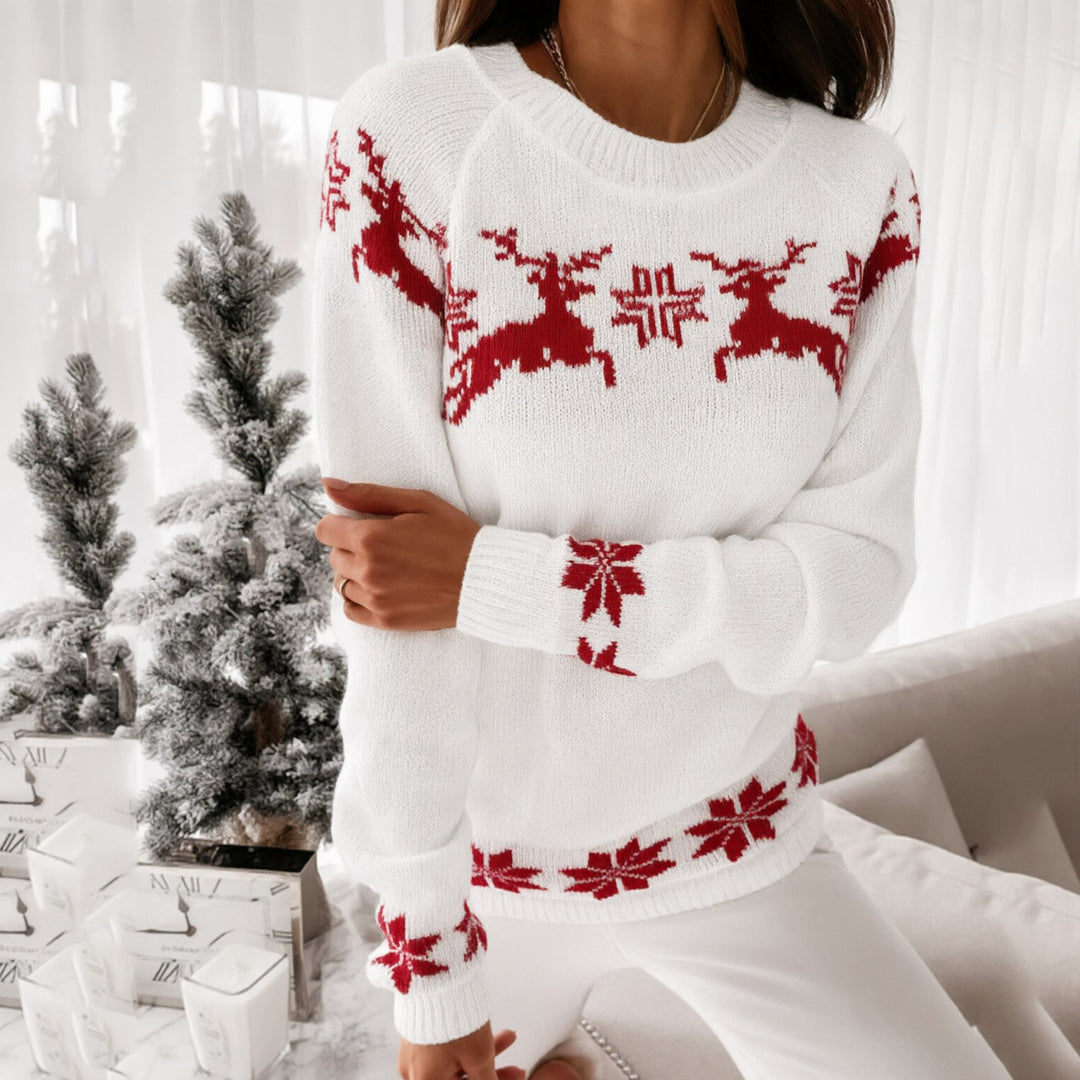 Noelani red Christmas sweater with white reindeer and snowflake print, front view