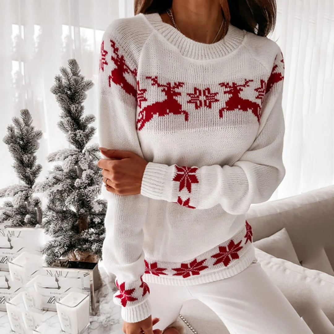 Noelani red Christmas sweater with white reindeer and snowflake print, front view