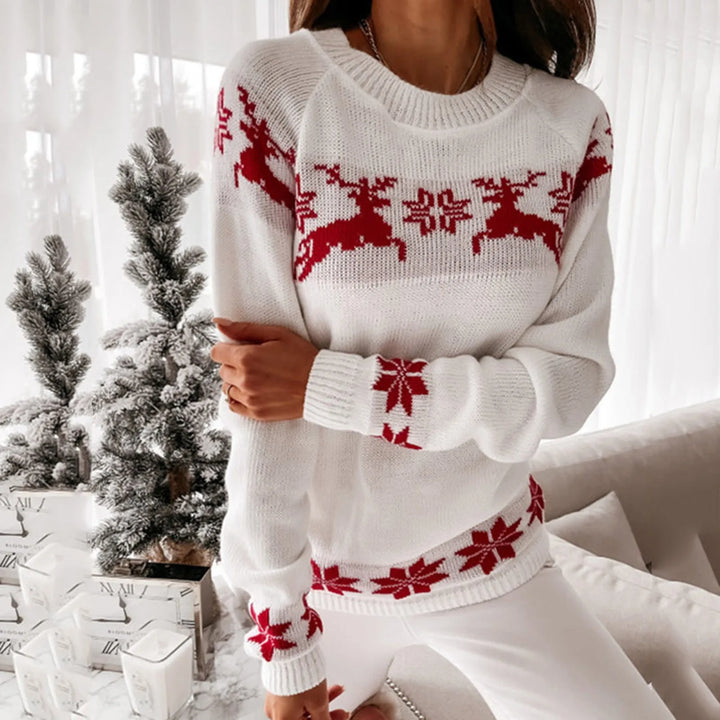 Noelani red Christmas sweater with white reindeer and snowflake print, front view