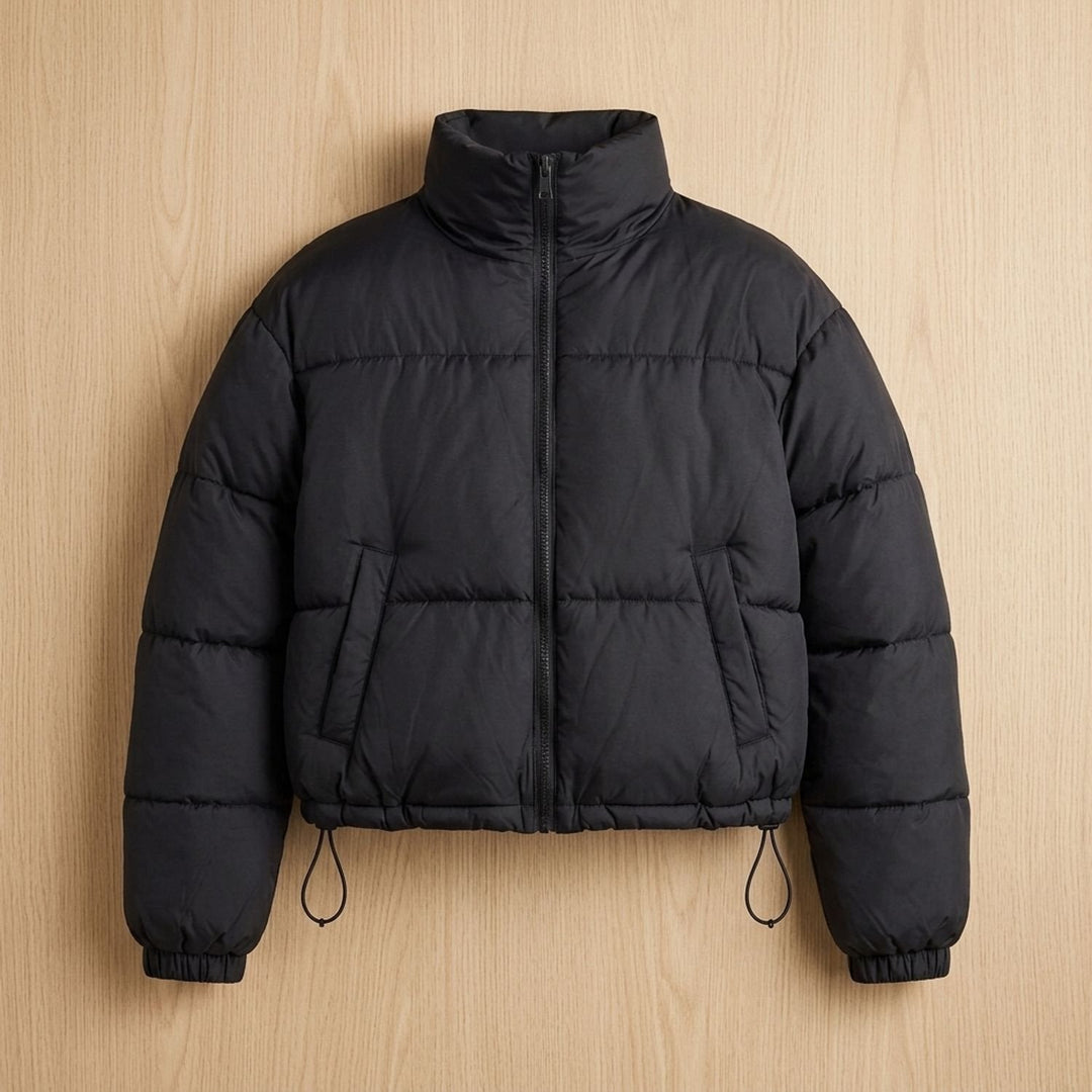 Odalys cropped puffer jacket in black, flat lay front view