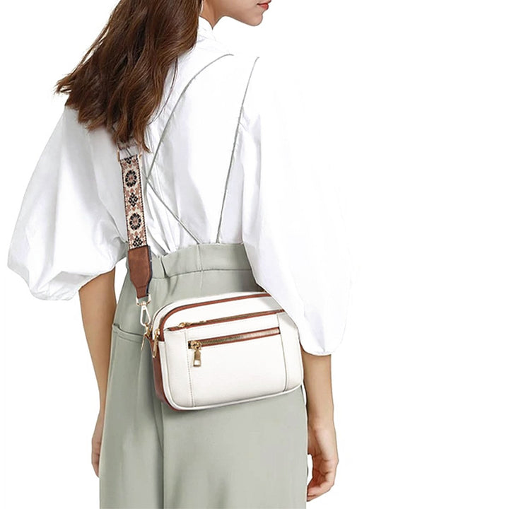 Woman wearing Marisol crossbody bag over suspenders, back view