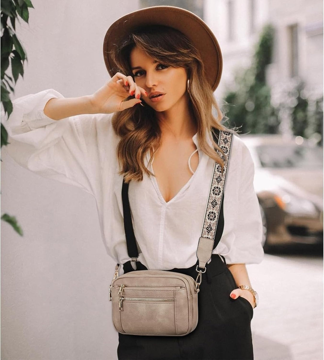 Woman in hat wearing Marisol crossbody bag, front view