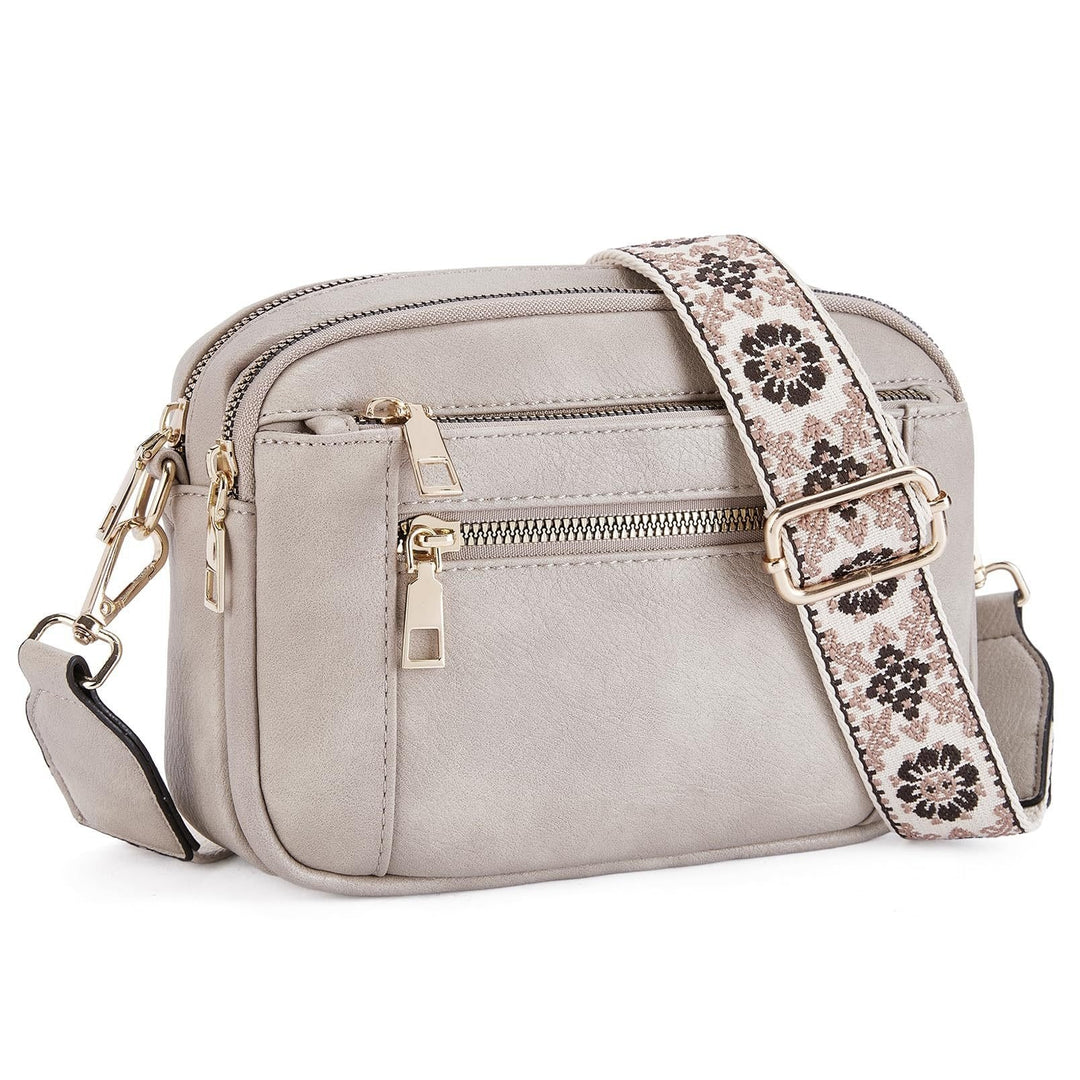 Woman carrying Marisol crossbody bag on shoulder, side view