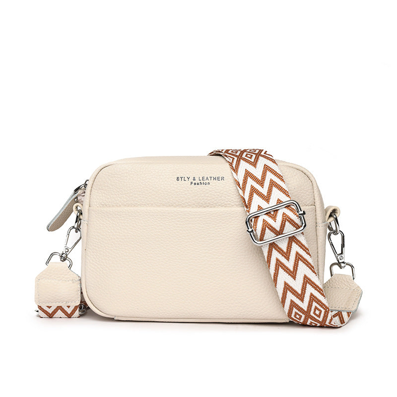 Rosalind crossbody bag in cream with patterned woven strap, front view