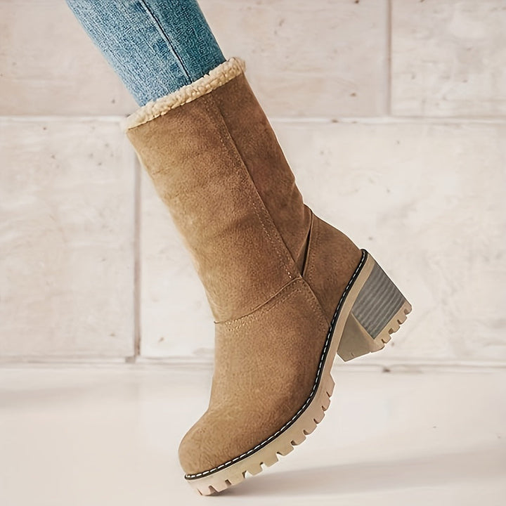 Rosalyn cuffed winter boot worn with jeans, side profile