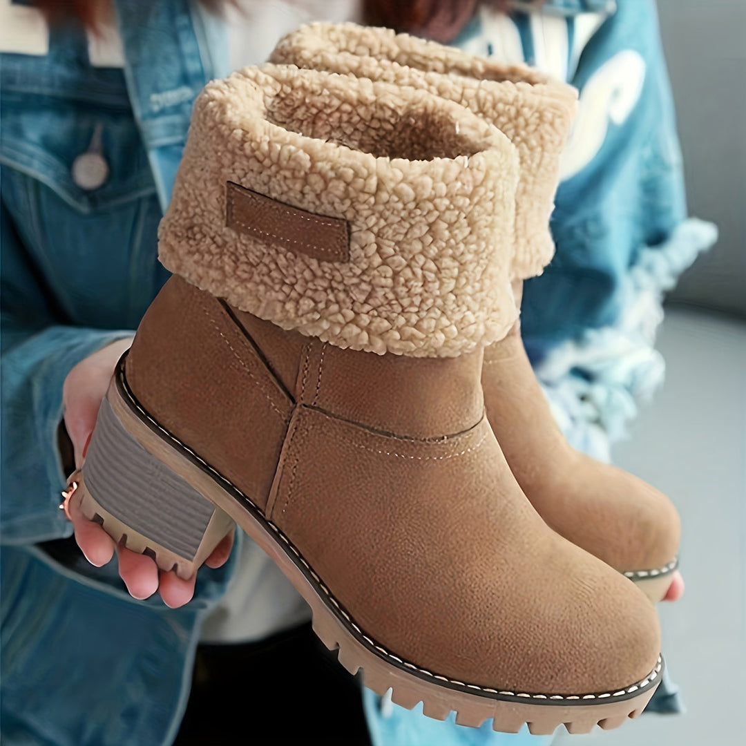 Rosalyn cuffed winter boots held in hand, close-up detail