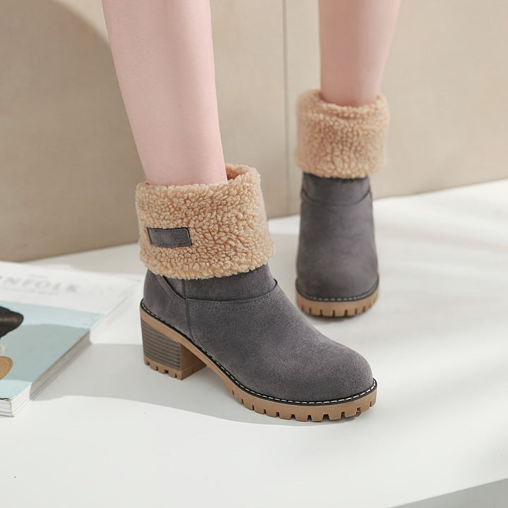 Rosalyn cuffed winter boots held in hand, close-up detail
