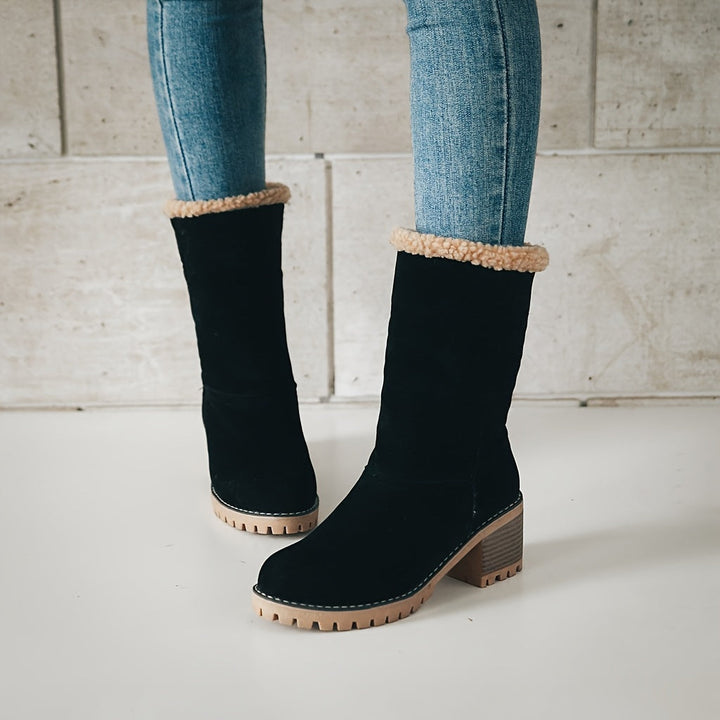 Rosalyn cuffed winter boots held in hand, close-up detail