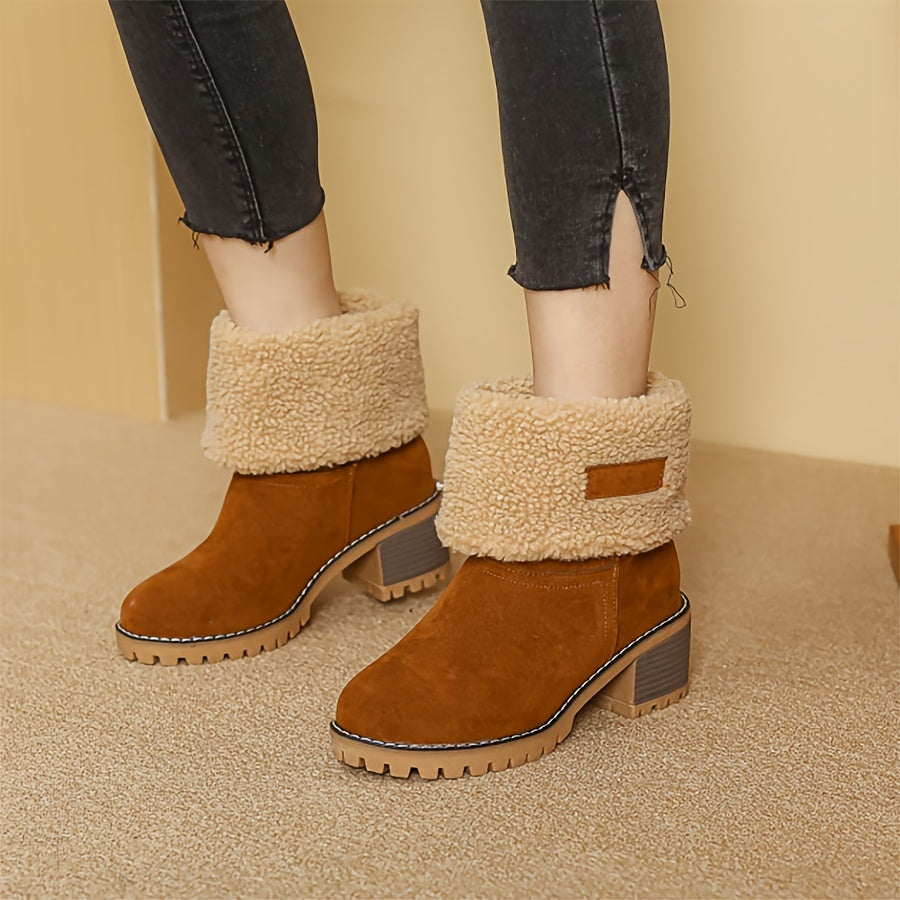 Rosalyn cuffed winter boots held in hand, close-up detail
