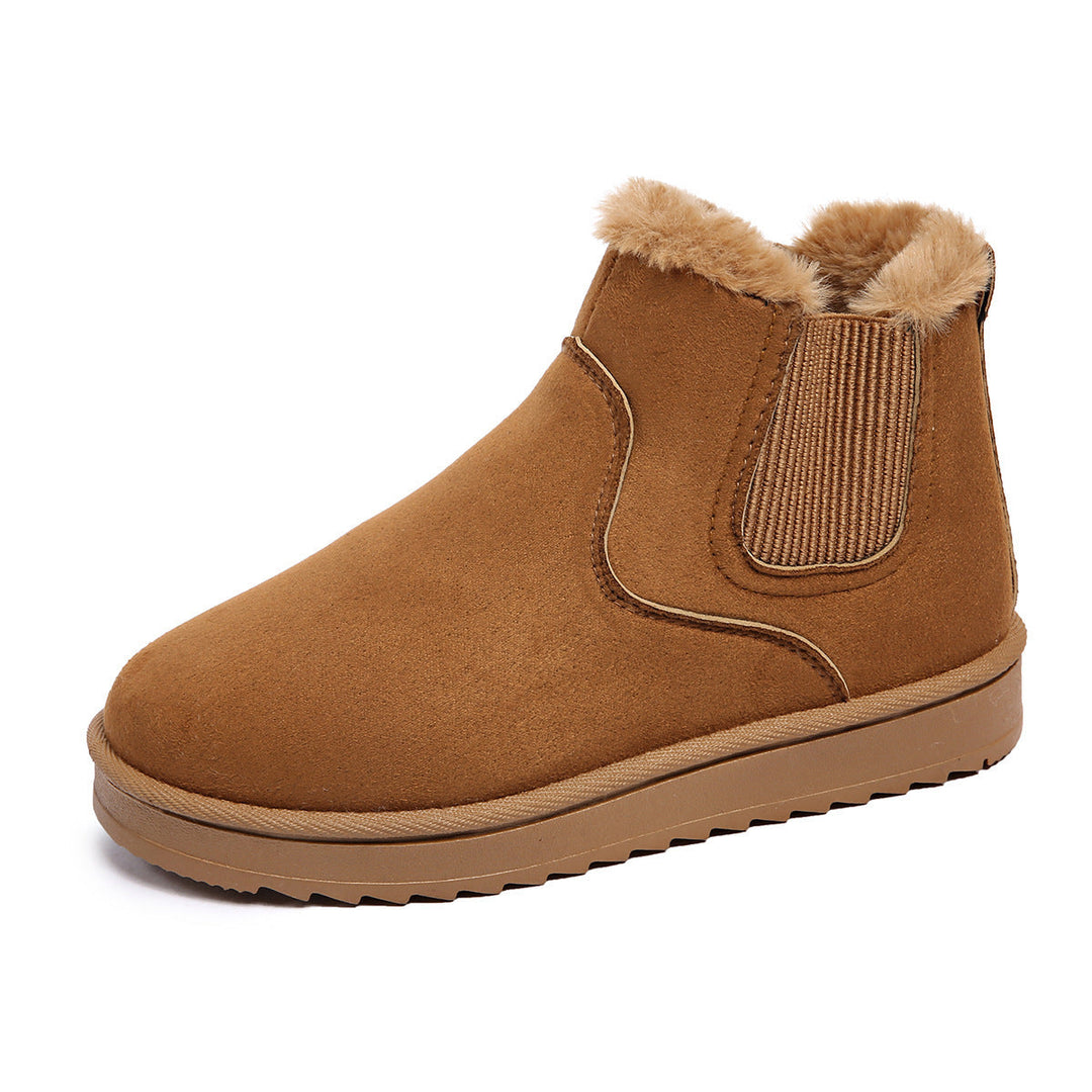 Marlowe faux fur lined Chelsea ankle boots in off-white, side view on model