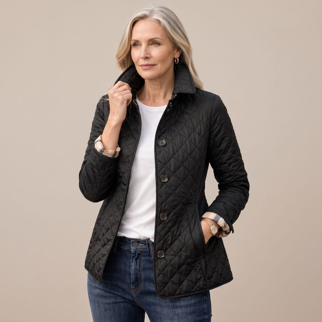 Vivienne fitted quilted winter jacket in black, front view with collar raised