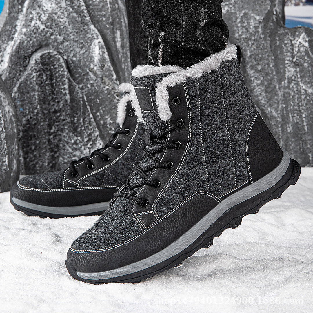 Marguerite fleece lined snow boots on feet, side view against rocky winter backdrop
