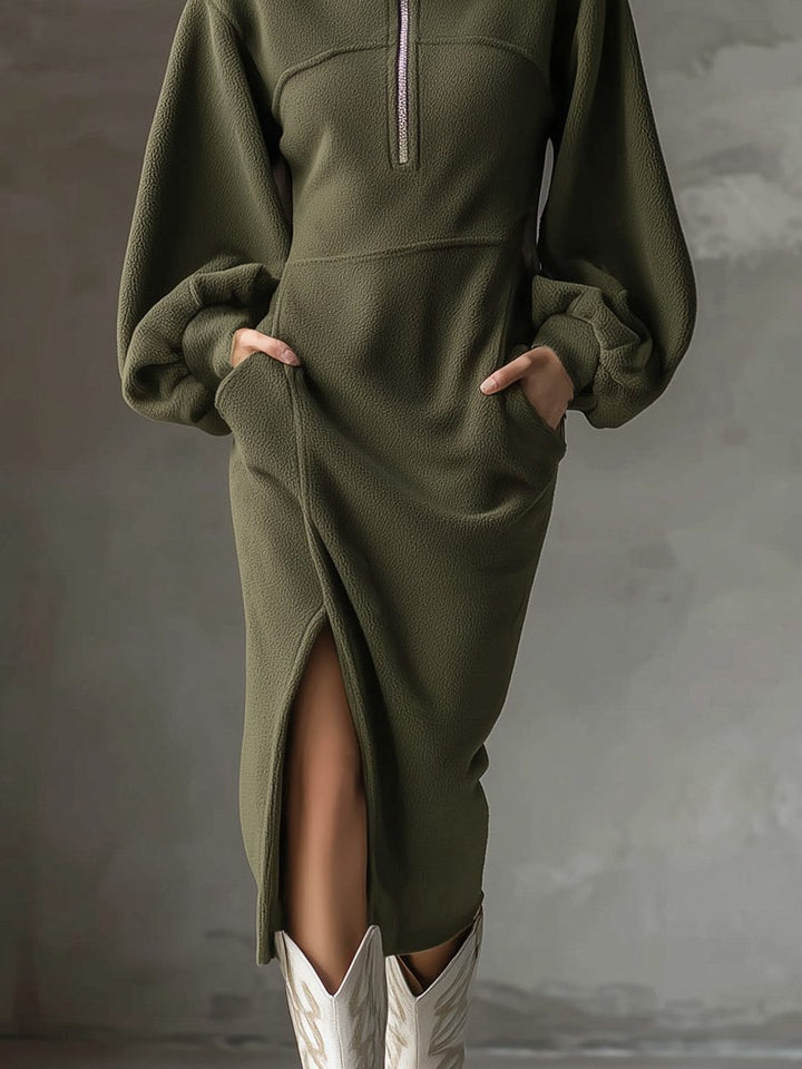 Marigold sweater dress side slit hem detail with hands in pockets