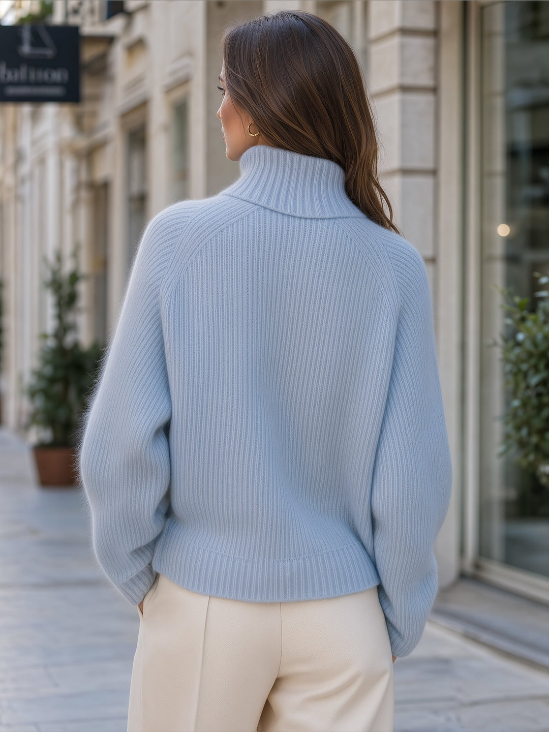 Thessalind light blue ribbed sweater, back view showing raglan sleeves