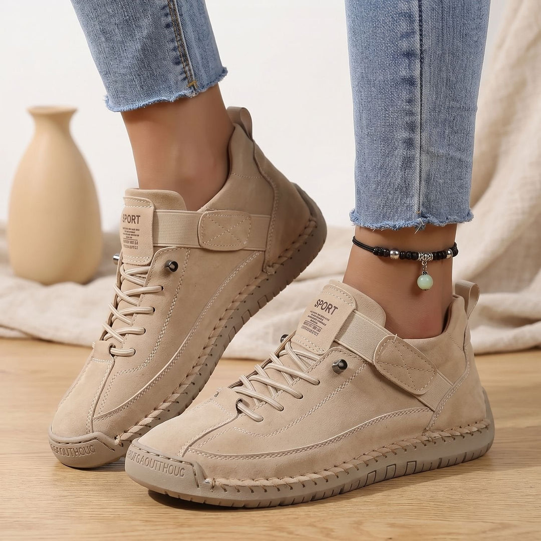 Rosalind high-top lace-up sneakers in beige, side view on model