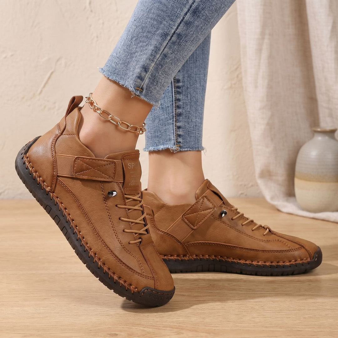 Rosalind high-top lace-up sneakers in green, side view on model