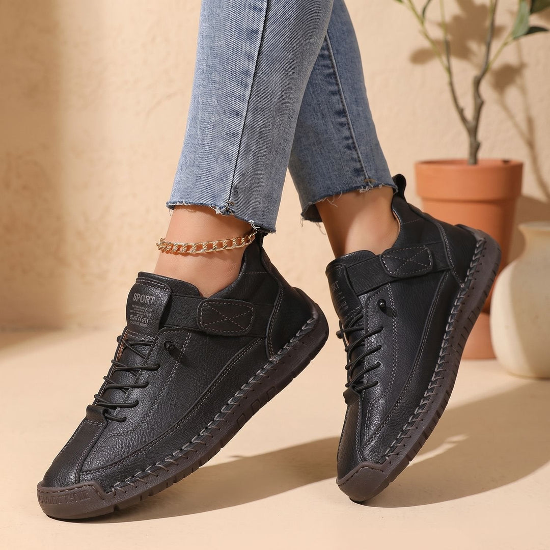 Rosalind high-top lace-up sneakers in black, side view on model