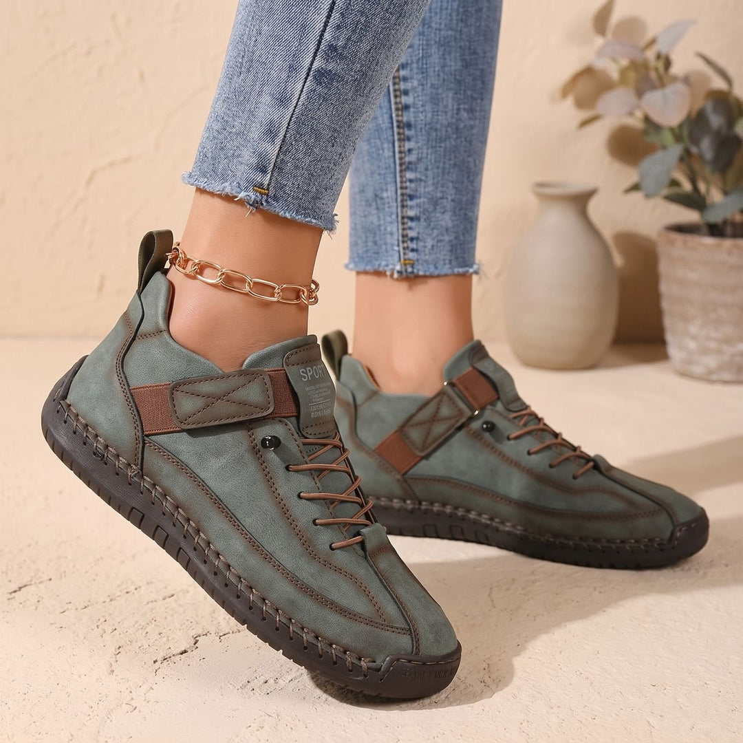 Rosalind high-top lace-up sneakers in green, side view on model