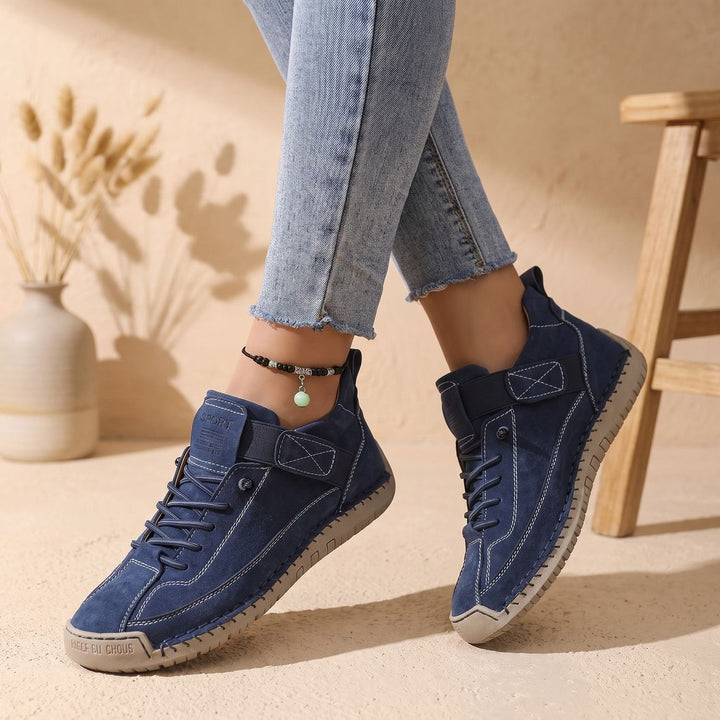 Rosalind high-top lace-up sneakers in green, side view on model