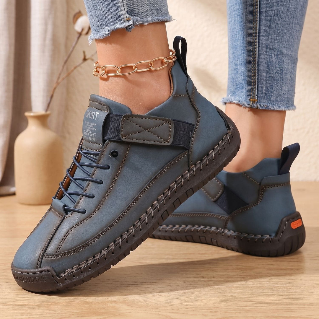 Rosalind high-top lace-up sneakers in green, side view on model