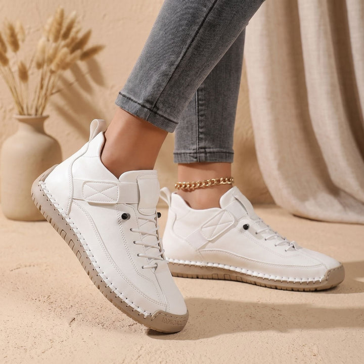 Rosalind high-top lace-up sneakers in green, side view on model