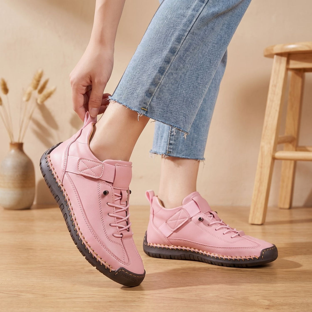 Rosalind high-top lace-up sneakers in green, side view on model