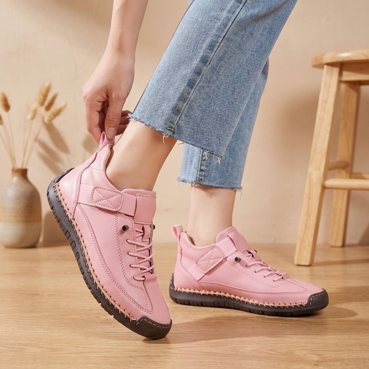 Rosalind high-top lace-up sneakers in green, side view on model