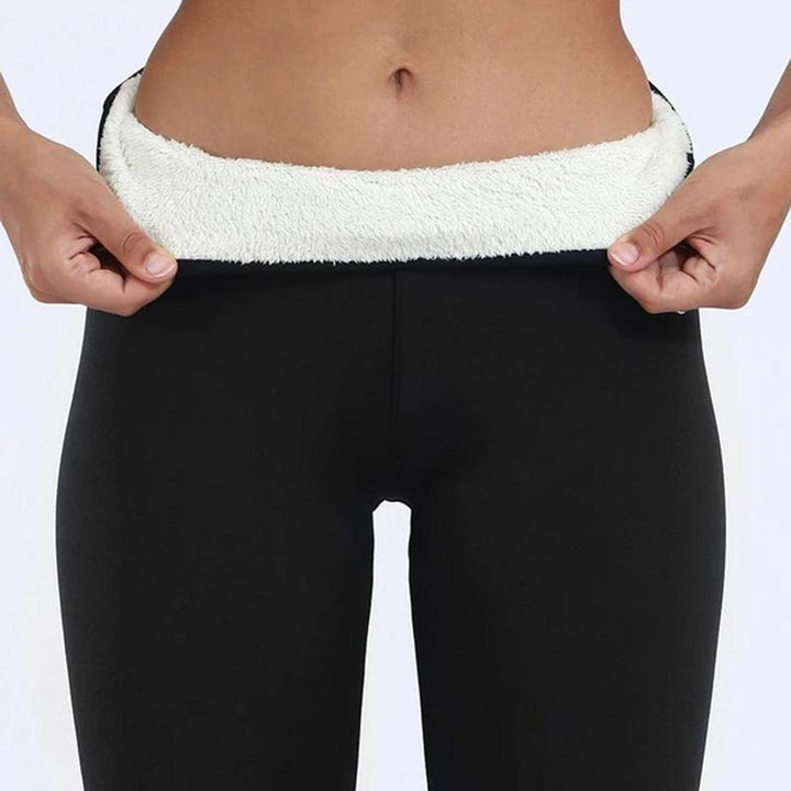Close-up of fleece lined ankle cuffs on black leggings