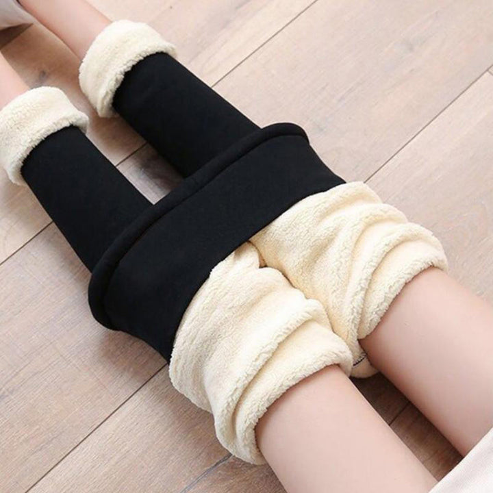 Close-up of fleece lined ankle cuffs on black leggings