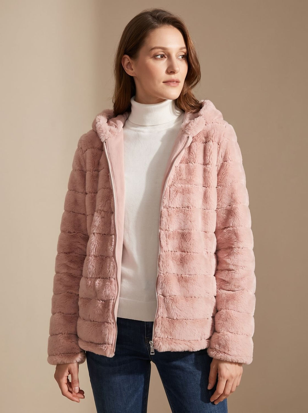 Rosalie hooded faux fur jacket in pink, worn open over a white sweater, front view