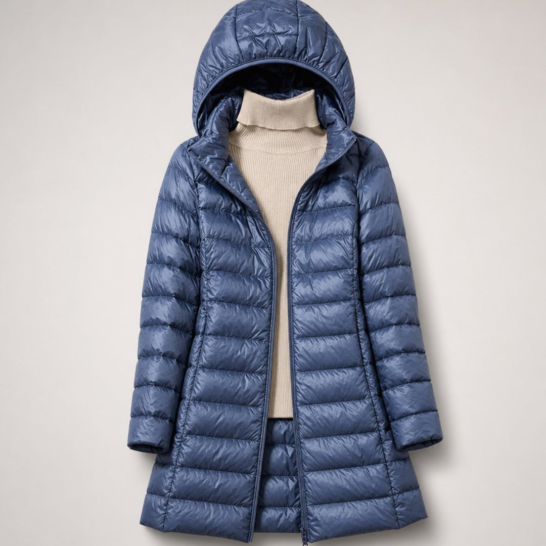 Wilhelmina long puffer jacket in neutral tone with hood, styled with handbag