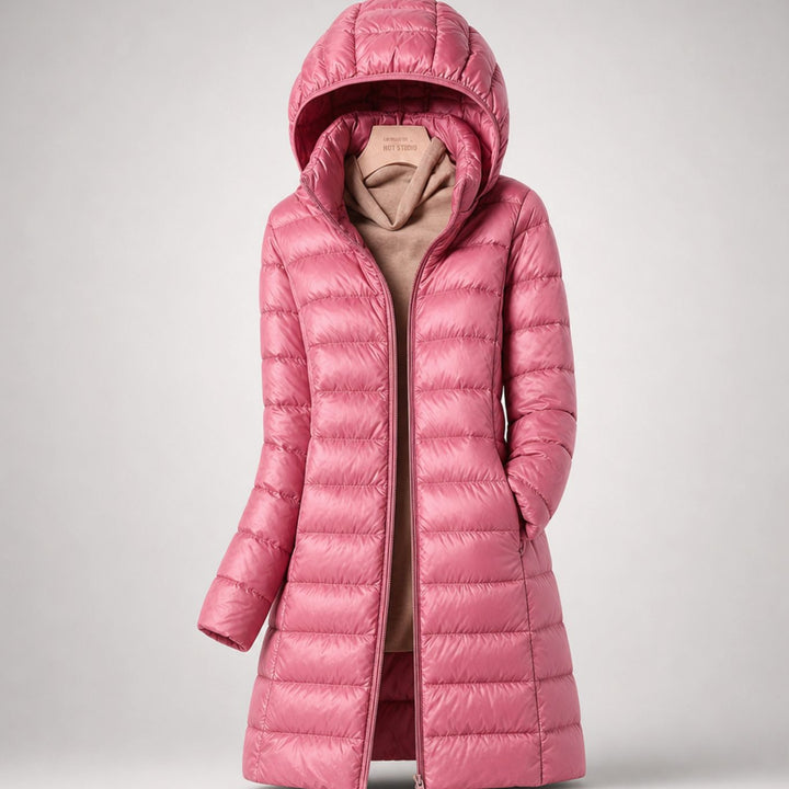Wilhelmina long puffer jacket in neutral tone with hood, styled with handbag
