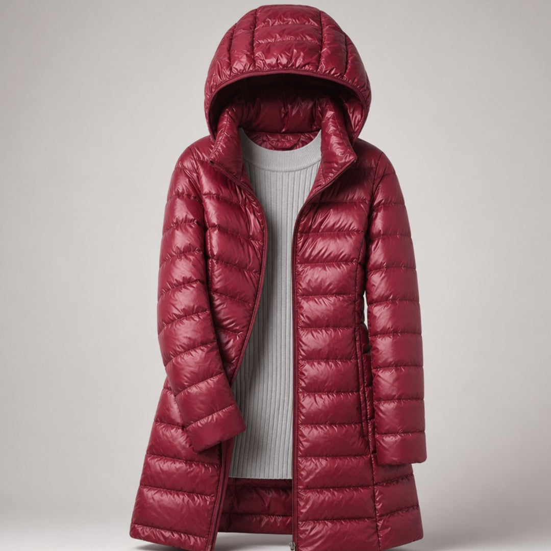 Wilhelmina long puffer jacket in neutral tone with hood, styled with handbag