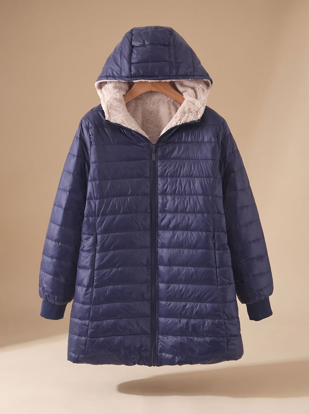 Marisabel navy hooded longline puffer jacket, front view on hanger