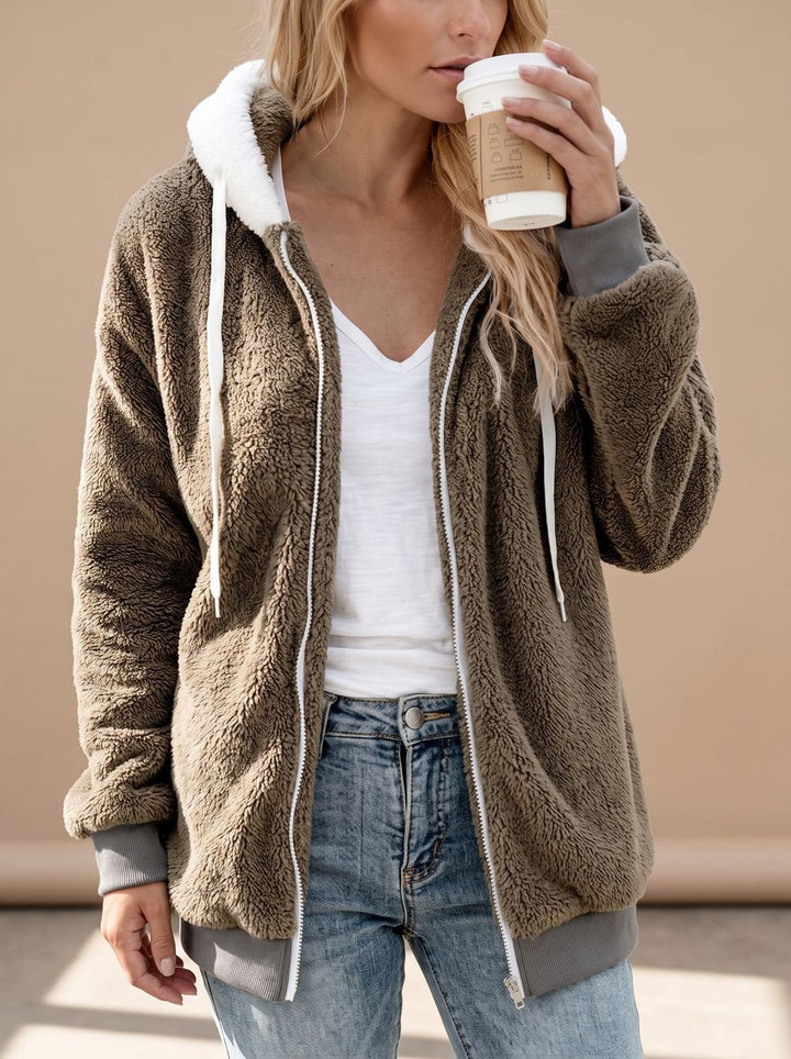 Rosamund hooded longline sherpa jacket in khaki, front view with coffee cup